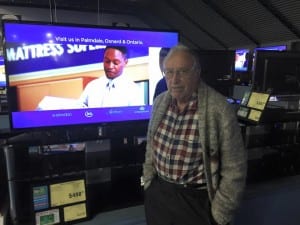 Dad at Fry's checking out TVs.