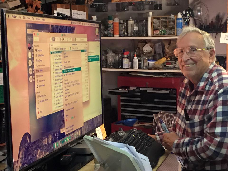 My dad looking happy with his new computer setup
